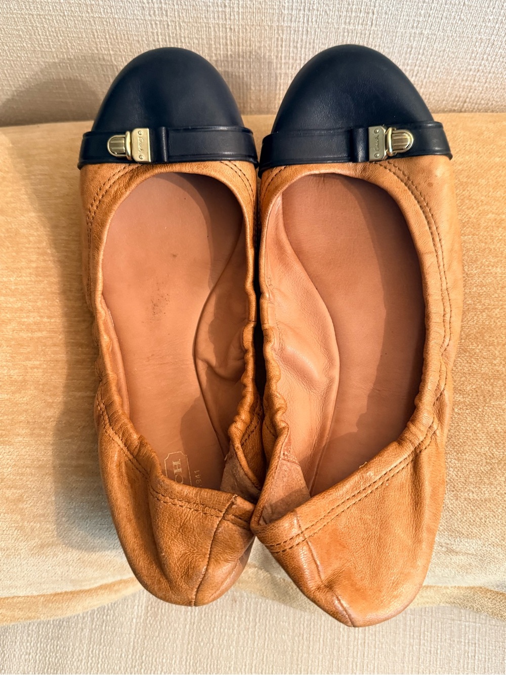 Coach Tan Leather Ballet Flats with Black Cap Toe and Gold Accent